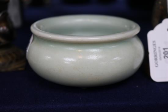 A Chinese Celadon glazed tripod censer
